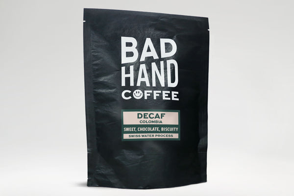 Bad Hand Coffee - Decaf from Colombia, decaffeinated using the Swiss water process - taste notes: sweet, chocolate, biscuity. Hand roasted and fresh to order. Available as whole bean or we can grind it to suit your home brew method. These 250 gramme bags are 100% paper and home compostable.