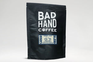Bad Hand Coffee - Two fifty gramme bag of Cargo Blend coffee roasted with taste notes of toasted almonds, milk chocolate, and amaretto. Suitable for espresso and filter brewing.