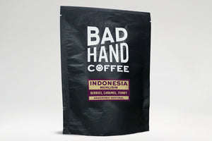 Bad Hand Coffee - 250g bag of Indonesia Muhlisn, single origin coffee, with taste notes of tangerine, cacao and juicy. Hand roasted and fresh to order. Available as whole bean or we can grind it to suit your home brew method.