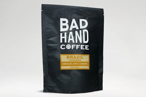 Two fifty gramme postal bag of Brazil Cerrado - taste notes: chocolate, nuts, caramel. Hand roasted and fresh to order from. Available as whole bean or we can grind it to suit your home brew method. These bags are 100% paper and home compostable.