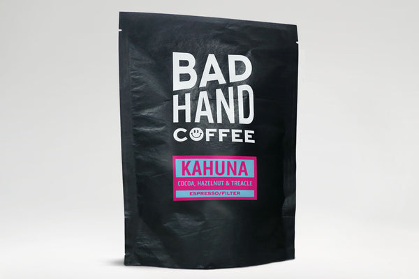 Bad Hand coffee - Two fifty gramme postal bag of Kahuna, a blend of coffees from Brazil with taste notes of cocoa, hazelnut and treacle, hand roasted and fresh to order. Available as whole bean or ground to your brew method. These bags are 100% paper and home compostable.